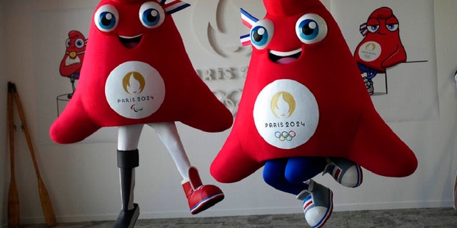 The mascots of the Paris 2024 Olympics, right, and the Paralympics, a Phrygian cap, jump during a preview in Saint Denis, outside Paris. The bright red soft cap, also known as the liberty cap, is an updated version of a conical hat worn in ancient times in places like Persia, the Balkans, Thrace, Dacia and Phrygia, where it originated the name, in present-day Turkey.