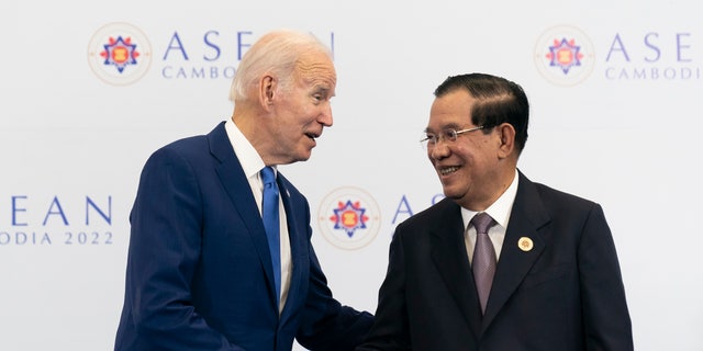 President Biden shakes hands with Cambodian Prime Minister Hun Sen before their meeting during the Association of Southeast Asian Nations summit, Saturday, Nov. 12, 2022, in Phnom Penh, Cambodia. 