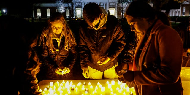 Students and community members gather for a candlelight vigil after a shooting that left three students dead at the University of Virginia, Monday, Nov. 14, 2022, in Charlottesville.