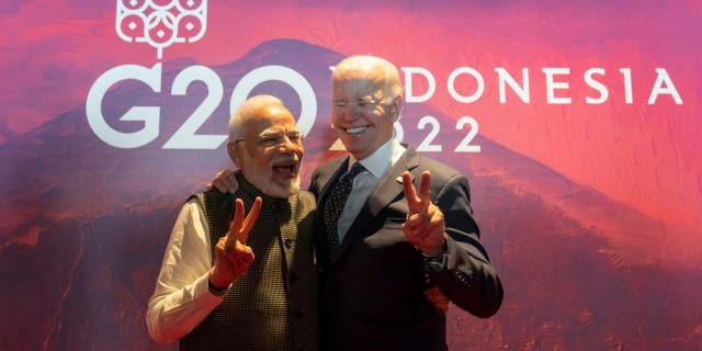 President Biden, right, gestures with India's Prime Minister Narendra Modi before the Partnership for Global Infrastructure and Investment meeting at the G20 summit, Tuesday, Nov. 15, 2022, in Nusa Dua, Bali, Indonesia.