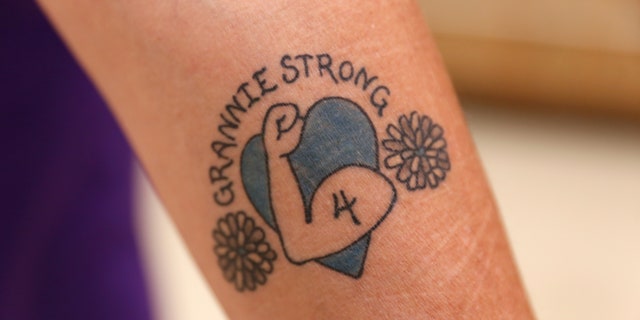 Jan Kwiatkowski shows her "Granny Strong" tattoo after a Milwaukee Dancing Grannies practice in Milwaukee Nov. 2, 2022. 