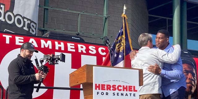 Gov. Brian Kemp campaigns with Senate candidate Herschel Walker on Saturday, Nov. 19, 2022 in Smyrna, Georgia.