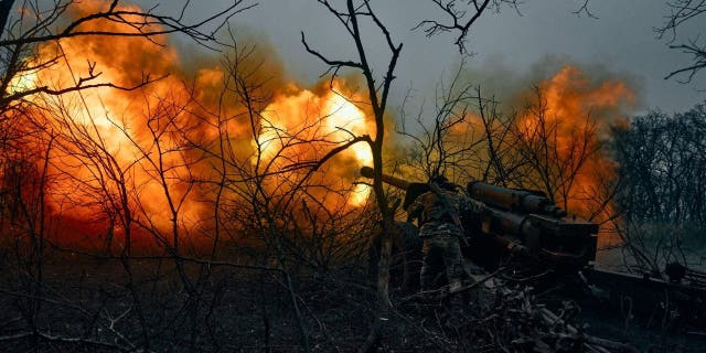 Ukrainian soldiers fire artillery at Russian positions near Bakhmut, Donetsk region, Ukraine, Sunday, Nov. 20, 2022.