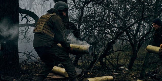 Ukrainian soldiers fire an artillery at Russian positions near Bakhmut, Donetsk region, Ukraine, Sunday, Nov. 20, 2022. 
