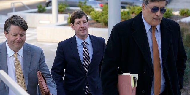 Former Republican state Sen. Brian Kelsey, center, arrives with legal team at federal court Tuesday, Nov. 22, 2022, in Nashville, Tenn.