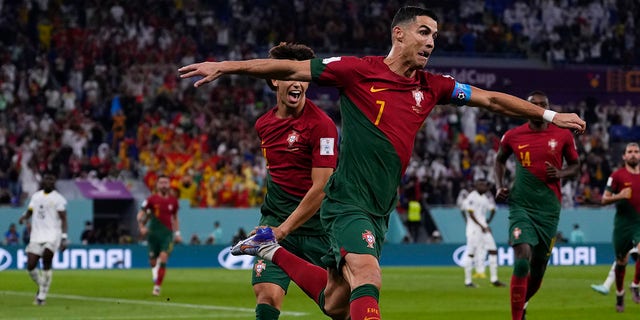 Portugal's Cristiano Ronaldo celebrates after scoring his team's first goal from the penalty spot against Ghana during the FIFA World Cup Group H soccer match at Stadium 974 in Doha, Qatar, Thursday, Nov. 24, 2022. 