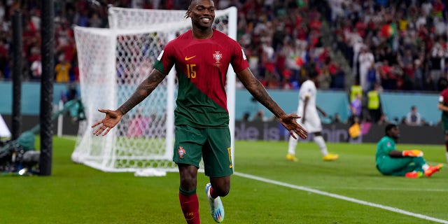 Portugal's Rafael Leao celebrates scoring his side's third goal against Ghana during a World Cup Group H soccer match at the Stadium 974 in Doha, Qatar, Thursday, Nov. 24, 2022. 