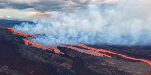 In this aerial photo released by the U.S. Geological Survey, the Mauna Loa volcano is seen erupting from vents on the Northeast Rift Zone on the Big Island of Hawaii, Monday, Nov. 28, 2022. Hawaii's Mauna Loa, the world's largest active volcano, began spewing ash and debris from its summit, prompting civil defense officials to warn residents on Monday to prepare in case the eruption causes lava to flow toward communities.