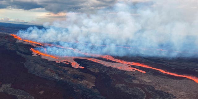In this aerial photo released by the U.S. Geological Survey, the Mauna Loa volcano is seen erupting from vents on the Northeast Rift Zone on the Big Island of Hawaii, Monday, Nov. 28, 2022. Hawaii's Mauna Loa, the world's largest active volcano, began spewing ash and debris from its summit, prompting civil defense officials to warn residents on Monday to prepare in case the eruption causes lava to flow toward communities.