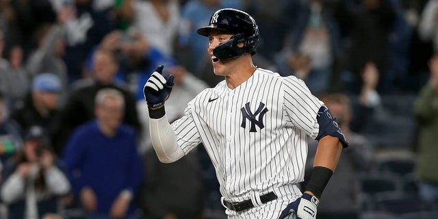 Aaron Judge of the New York Yankees celebrates his walk-off home run against the Toronto Blue Jays at Yankee Stadium on May 10, 2022, in New York City.