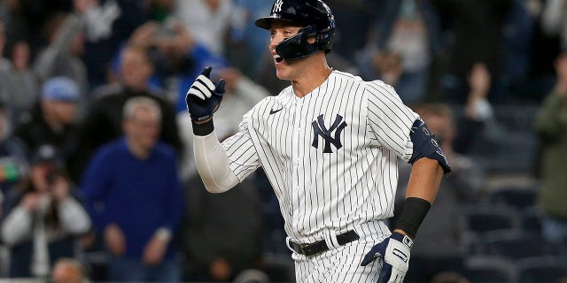 Aaron Judge of the New York Yankees celebrates his walk-off home run against the Toronto Blue Jays at Yankee Stadium on May 10, 2022, in New York City.