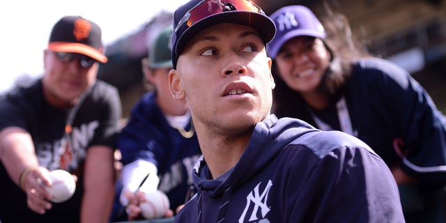 New York Yankees' Aaron Judge signs autographs before a game against the San Francisco Giants at Oracle Park, April 27, 2019, in San Francisco.