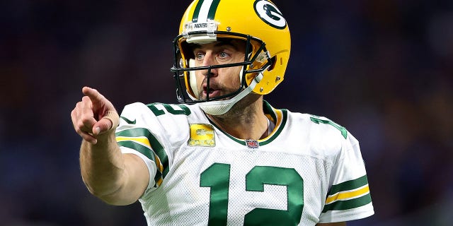 Aaron Rodgers, #12 of the Green Bay Packers, signals at the line of scrimmage against the Detroit Lions during the first half at Ford Field on Nov. 06, 2022 in Detroit.