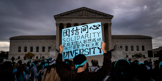 People rally in support of affirmative action in college admissions as arguments start on the cases at the Supreme Court on Capitol Hill on Monday, Oct 31, 2022 in Washington, DC.