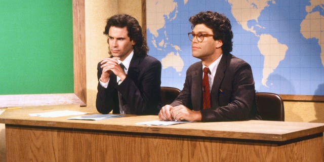 Dennis Miller, left, and Al Franken during the "Saturday Night Live" skit "Weekend Update" on Oct. 17, 1987.