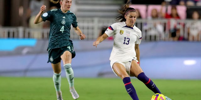 Alex Morgan (13) of the United States controls the ball against Sophia Kleinherne of Germany during the first half in the women's international friendly match, Nov. 10, 2022, in Fort Lauderdale, Florida.