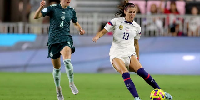 Alex Morgan (13) of the United States controls the ball against Sophia Kleinherne of Germany during the first half in the women's international friendly match, Nov. 10, 2022, in Fort Lauderdale, Florida.