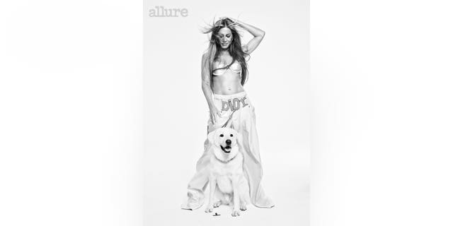 Jennifer Aniston poses with her dog Chesterfield for Allure.