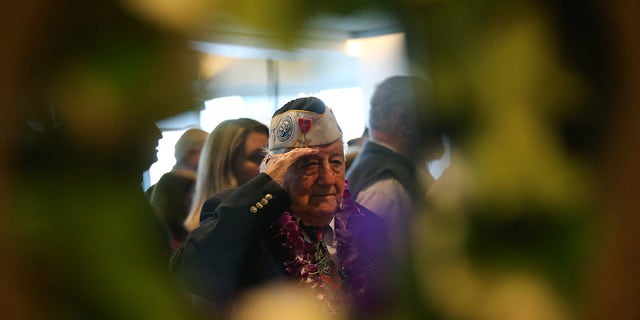 Armando "Chick" Galella, at age 97, is pictured saluting during an event on the USS Intrepid to mark the 77th anniversary of the attack on Pearl Harbor on Dec. 7, 2018, in New York City.