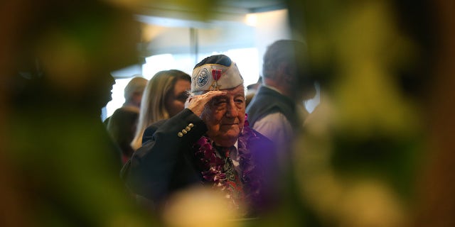 Armando "Chick" Galella, at age 97, is pictured saluting during an event on the USS Intrepid to mark the 77th anniversary of the attack on Pearl Harbor on Dec. 7, 2018, in New York City.