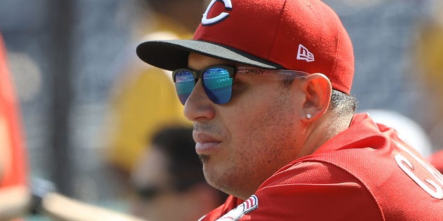 Cincinnati Reds third baseman Asdrubal Cabrera watches from the dugout during the Pirates game at PNC Park in Pittsburgh, Sept.  16, 2021.