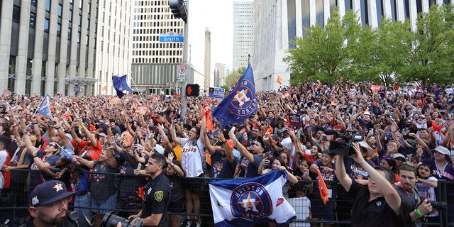 Fans line the streets of downtown to watch the World Series Parade on November 7, 2022 in Houston, Texas.