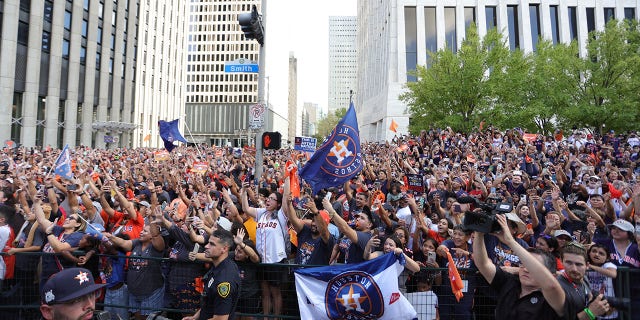 Fans fill the streets of downtown Houston to watch the World Series parade on Nov. 7, 2022.