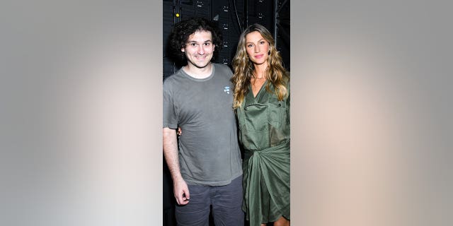 Sam Bankman-Fried poses with Gisele Bündchen at the FTX Salt Crypto Bahamas conference on Wednesday, April 27, 2022.