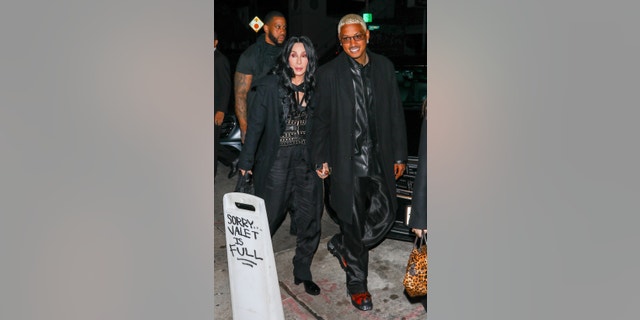 Cher sparked romance rumors when she stepped out with 36-year-old music executive Alexander "A.E." Edwards."
