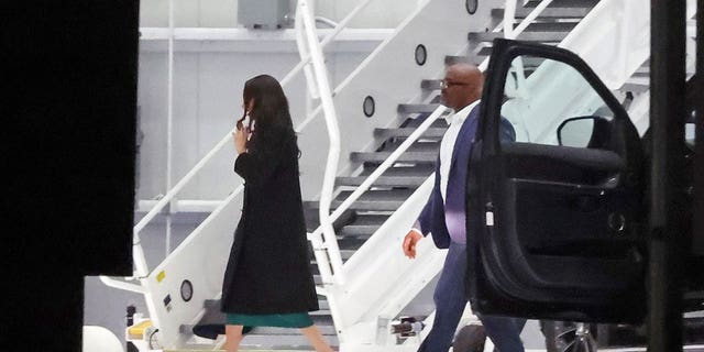 Meghan Markle leaves from the Indianapolis Colts private team hangar on a jet after flying in for just three hours.