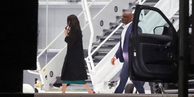 Meghan Markle leaves from the Indianapolis Colts private team hangar on a jet after flying in for just three hours.