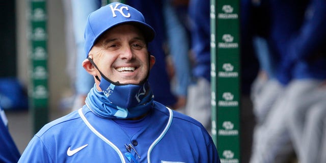 Pedro Grifol of the Kansas City Royals smiles in the dugout before a game against the Tigers at Comerica Park on April 24, 2021, in Detroit.