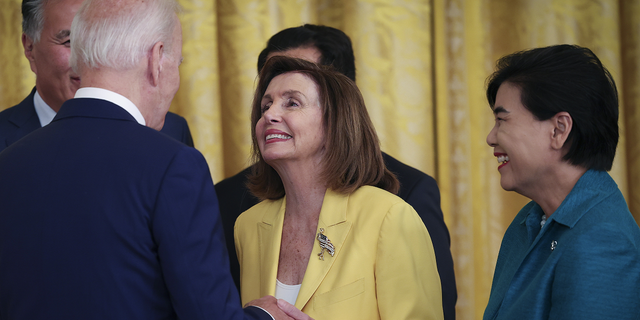 U.S. House Speaker Nancy Pelosi chats with President Joe Biden after signing a bill in the East Room of the White House on June 13, 2022 in Washington, DC. Biden signed HR 3525, the "Commission to study the possible creation of a National Museum of Asian Pacific American History and Culture Act."