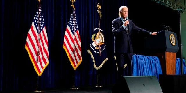 "I love those signs when I came in," Biden said. "Socialism. Give me a break, what idiots." (AP Photo/Patrick Semansky)