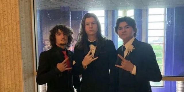 Bischoff (left) posing with his bandmates in the heavy metal band Hellfire. They launched a GoFundMe page to help his family pay for funeral expenses after he was crushed by a trash compactor.