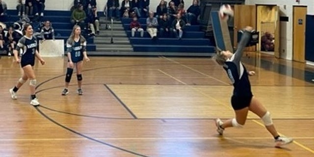 Blake Allen playing volleyball. The school opened her locker room to a biological male who identifies as a girl.