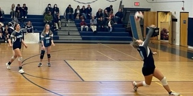 Blake Allen playing volleyball. The school opened her locker room to a biological male who identifies as a girl.