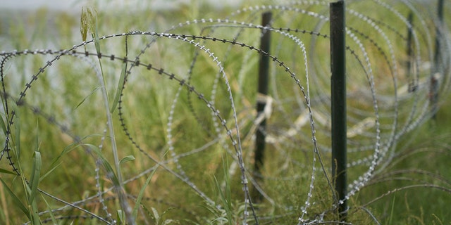  Razor wire separates the US southern border with Mexico in Eagle Pass, Texas. 