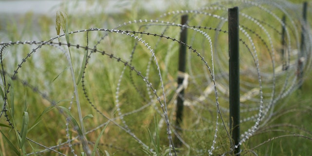 Razor wire separates the US southern border with Mexico in Eagle Pass, Texas.