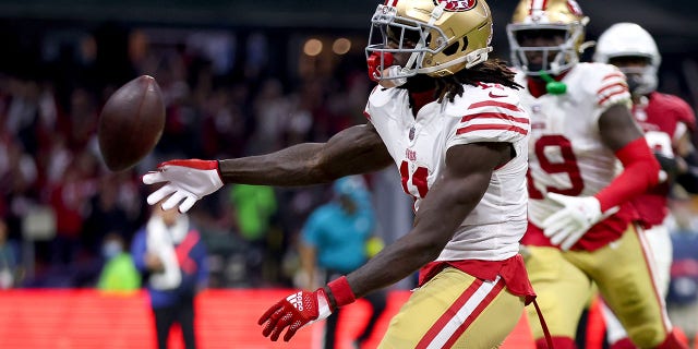 Brandon Aiyuk, #11 of the San Francisco 49ers, celebrates after scoring a touchdown against the Arizona Cardinals during the third quarter at Estadio Azteca on Nov. 21, 2022 in Mexico City.