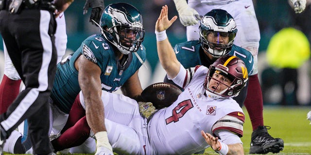 Washington Commanders quarterback Taylor Heinicke (4) pleads with the referee after a late hit by Philadelphia Eagles defensive end Brandon Graham (55) during a game Nov. 14, 2022 at Lincoln Financial Field in Philadelphia.