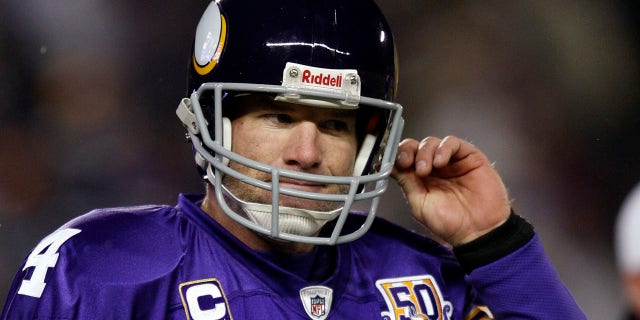Minnesota Vikings quarterback Brett Favre walks to the sideline after throwing a pass that was intercepted by Chicago Bears' Julius Peppers during the first quarter of their NFC, NFL football game at TCF Bank Stadium in Minneapolis, December 20, 2010 .