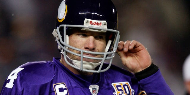 Minnesota Vikings quarterback Brett Favre heads to the sideline after throwing an intercepted pass by Chicago Bears' Julius Peppers during the first quarter of their NFC, NFL football game at TCF Bank Stadium in Minneapolis , on December 20, 2010.