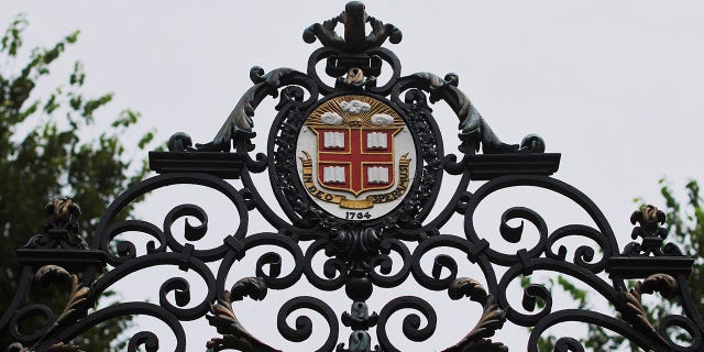 The seal of Brown University atop the Van Wickle Gates at the edge of the main campus in Providence, R.I., Aug. 16, 2022.