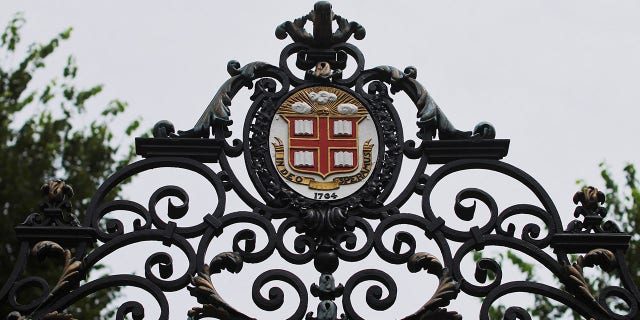 The Brown University seal atop the Van Wickle Gates at the edge of the main campus in Providence, Rhode Island on August 16, 2022.