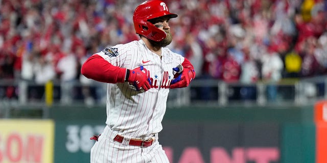 Philadelphia Phillies' Bryce Harper celebrates a two-run home run during the first inning in Game 3 of the World Series against the Houston Astros Nov. 1, 2022, in Philadelphia. 