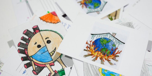 Letters and drawings left behind are collected at the Youth Pavilion at the United Nations Climate Summit COP27, Saturday, November 19, 2022, Sharm el-Sheikh, Egypt. 