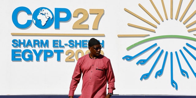 A man walks outside of the Sharm El Sheikh International Convention Centre during the COP27 climate summit opening in Egypt's Red Sea resort of Sharm el-Sheikh, Egypt November 6, 2022.