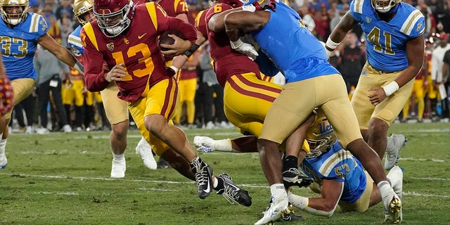 Southern California quarterback Caleb Williams runs in for a touchdown against UCLA Saturday, Nov. 19, 2022, in Pasadena, California.