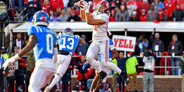 Cameron Latu (81) of the Alabama Crimson Tide catches a touchdown during the first half against the Mississippi Rebels at Vaught-Hemingway Stadium Nov. 12, 2022, in Oxford, Miss.